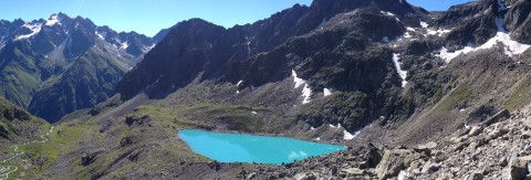 The turquoise colored Mittelberglesee in the Pitztal